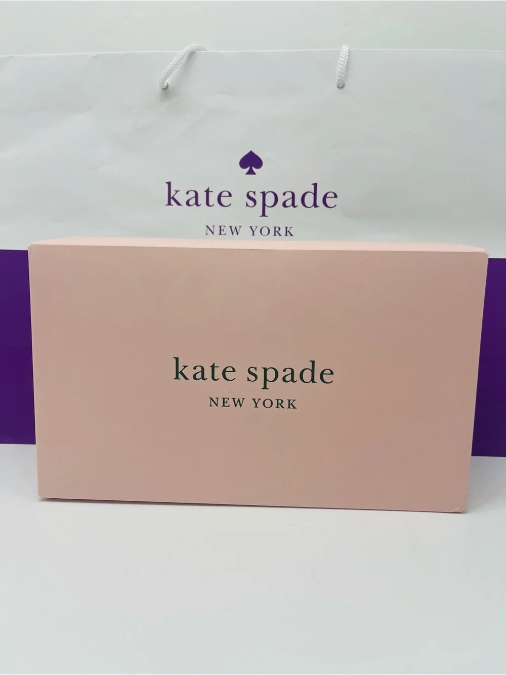 kate spade blush pink gift box with purple logo bag New
